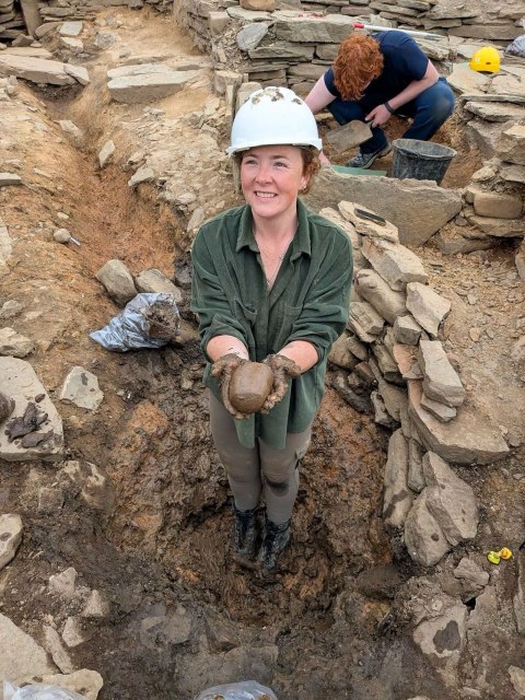 Dr Holly Young with one of the many stone tools from the Structure T sump at The Cairns. Today’s dig diary now online at archaeologyorkney.com.